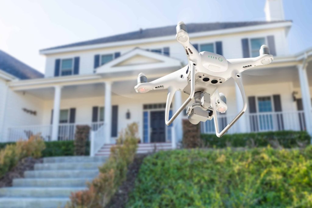 real estate video marketing tip, drone flying in front of house