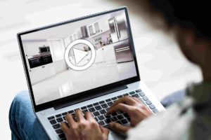creative real estate videos; man on laptop
